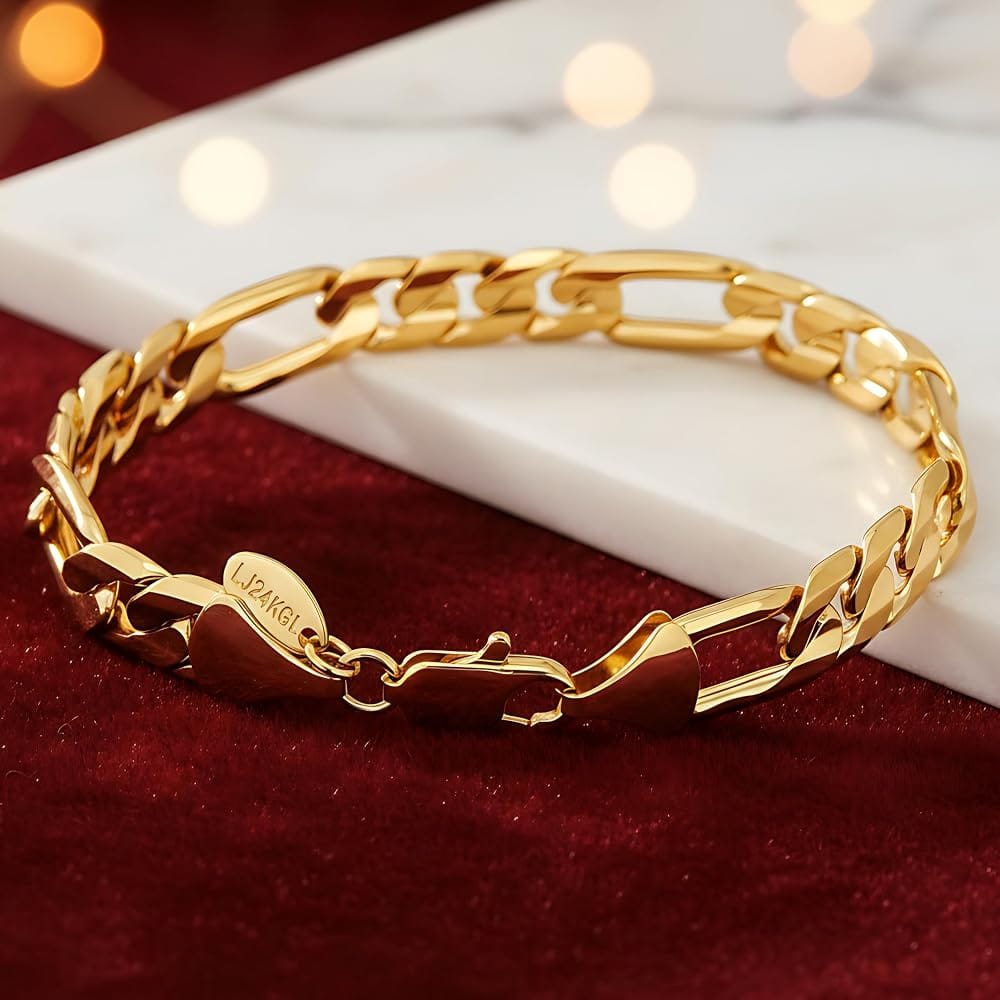 Gold figaro bracelet with engraved detail