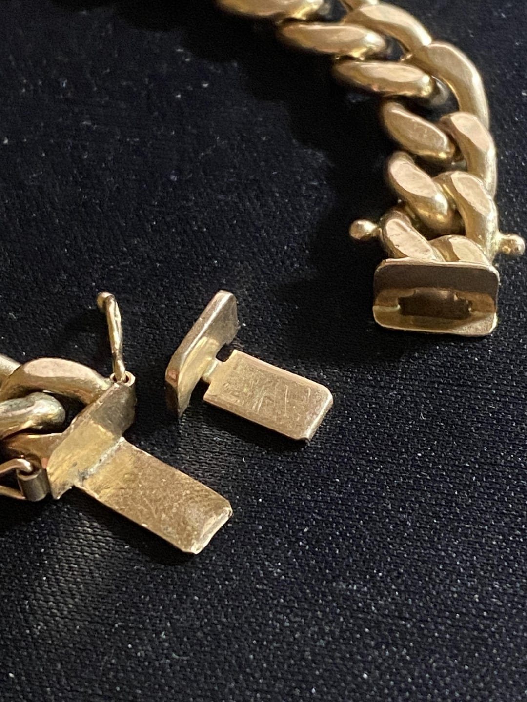 Close-up of a broken bracelet clasp before repair